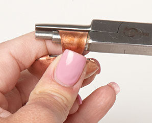 Wrapping the extra metal around wire wrapping pliers
